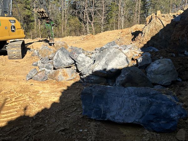 Large fractured rock uncovered during basement excavation